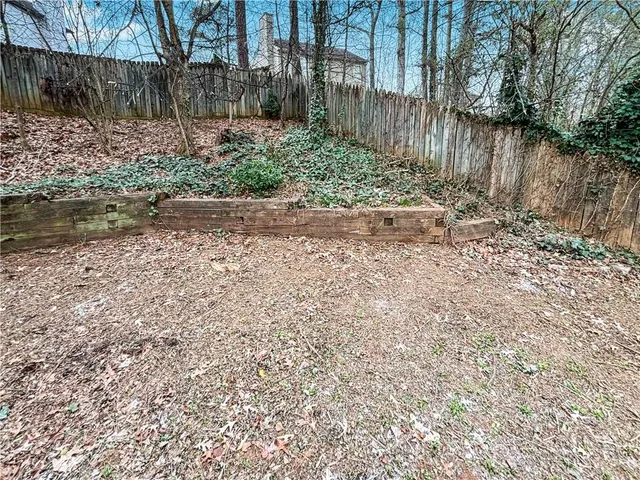 a backyard of a house with lots of green space