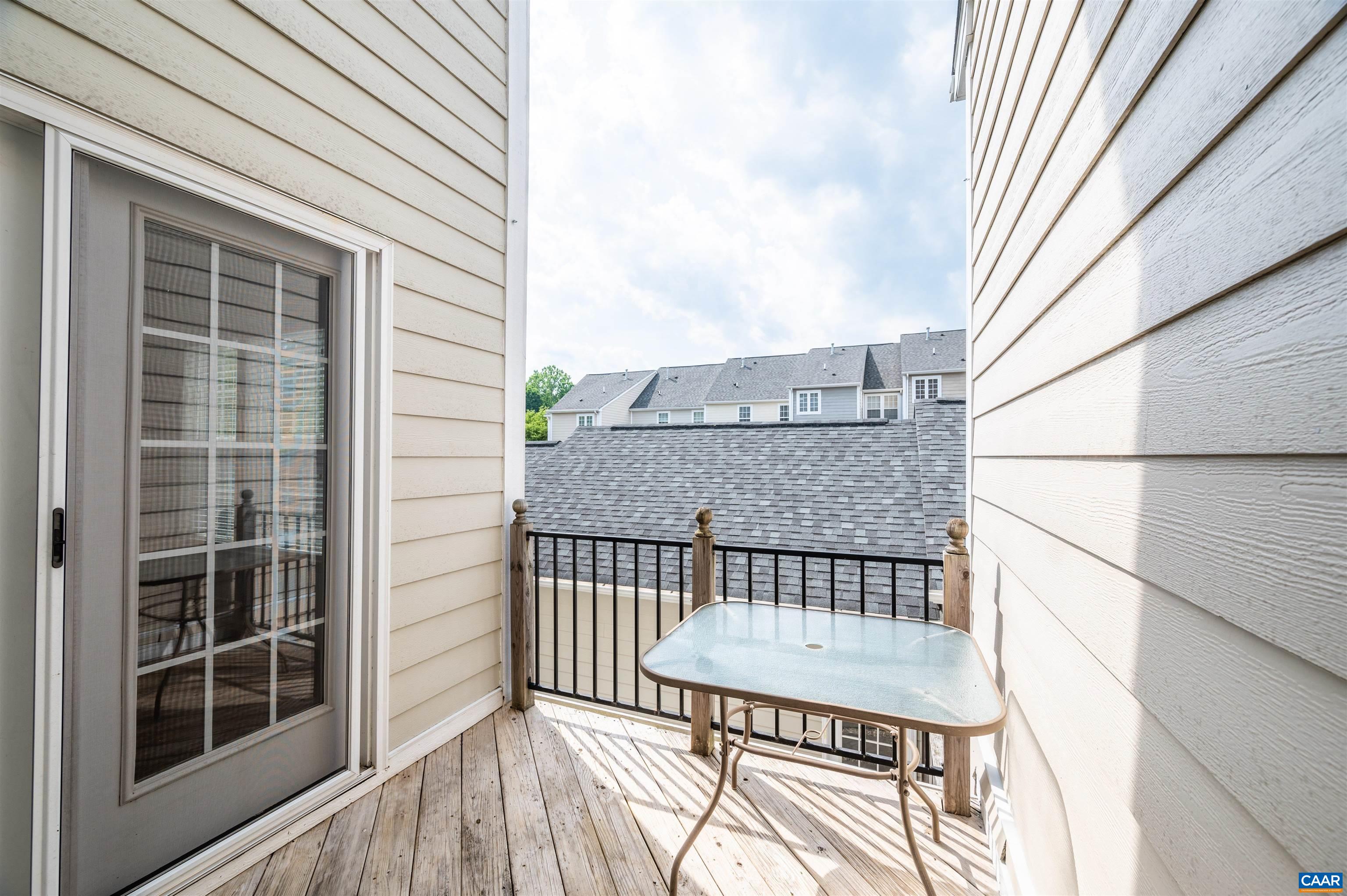 707 Rainier Road Charlottesville, VA 22903 - Photo 6 of 38 a view of a balcony with a table and chairs