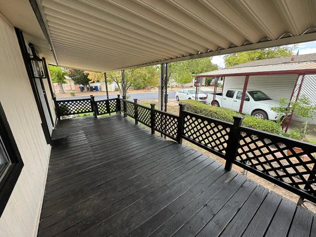a view of porch with wooden floor