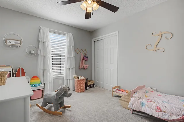 a bedroom with a workspace