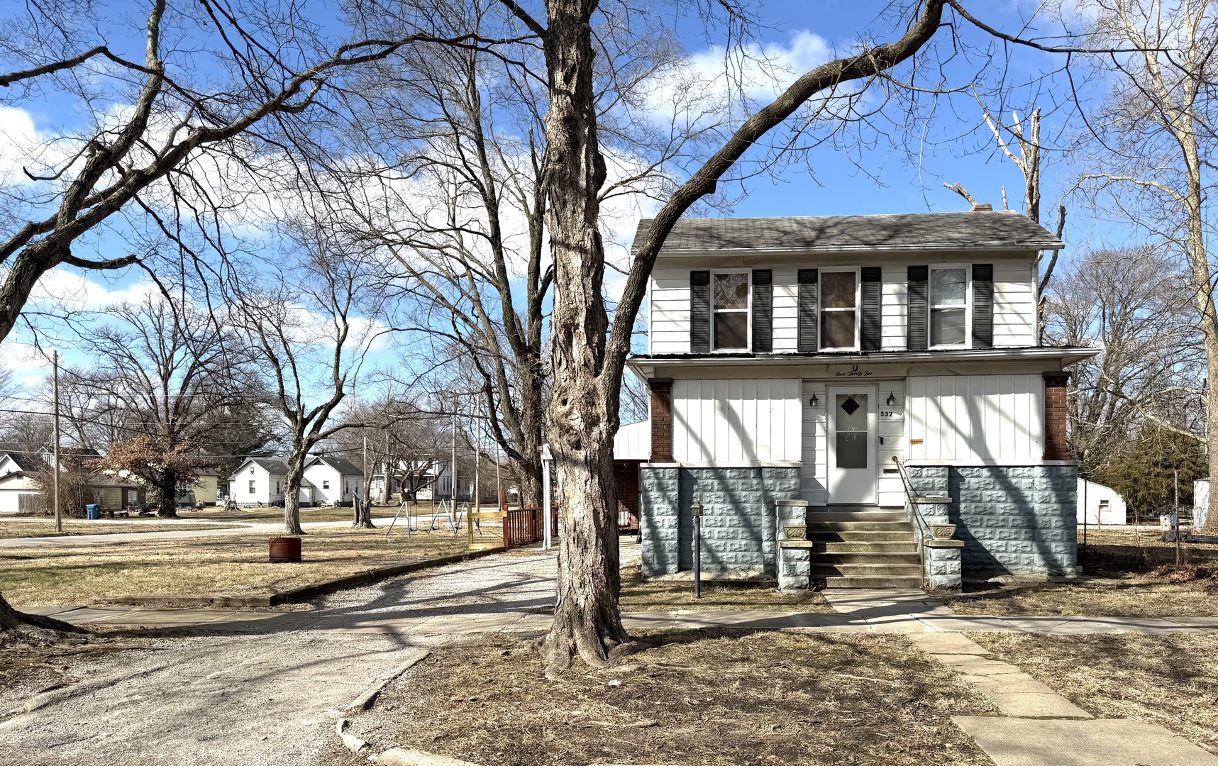 532 South Maple Street Centralia, IL 62801 - Photo 1 of 10 a view of a house with a yard covered with snow