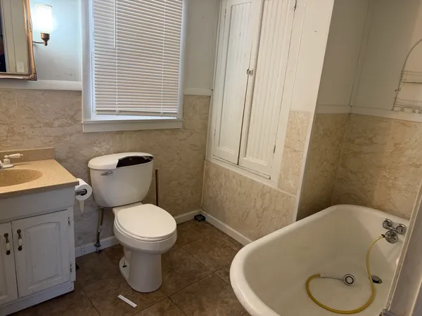 a bathroom with a toilet and a sink