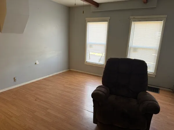 a living room with furniture and a window