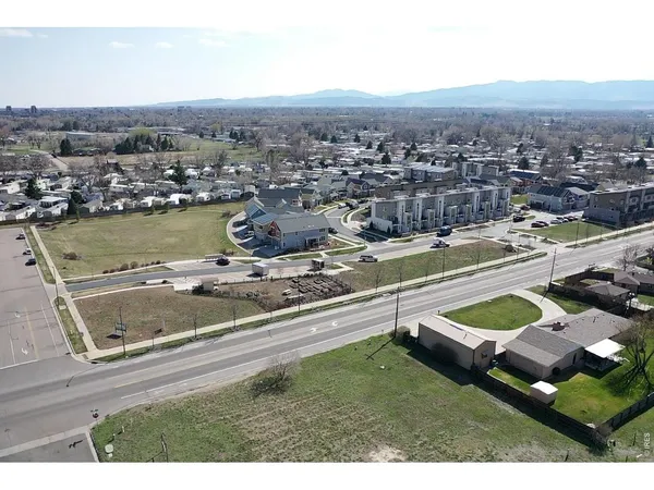 a view of a city with lawn chairs