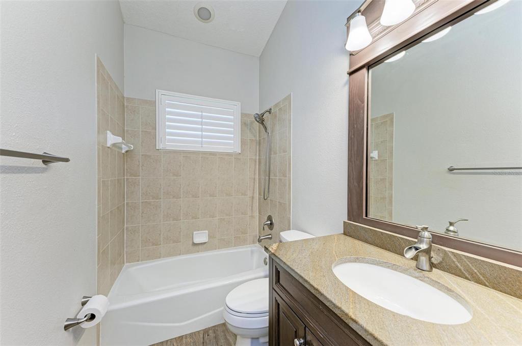 337 Snapdragon Loop Bradenton, FL 34212 - Photo 25 of 54 a bathroom with a sink toilet tub and shower