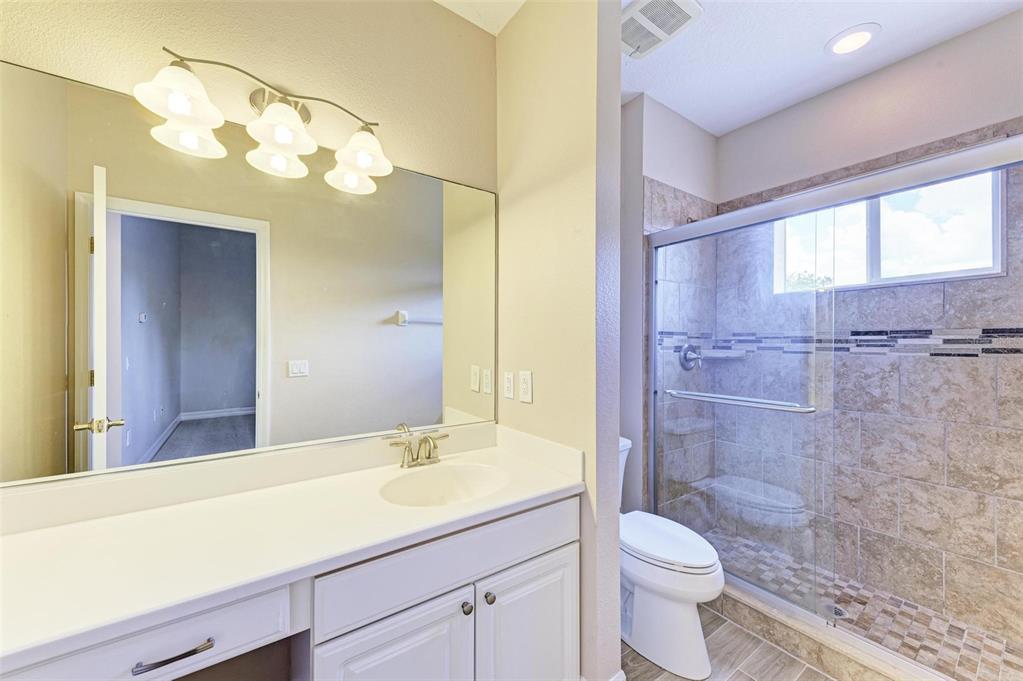 337 Snapdragon Loop Bradenton, FL 34212 - Photo 31 of 54 a bathroom with a sink a toilet and shower