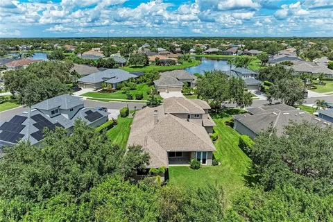a view of a swimming pool with a yard