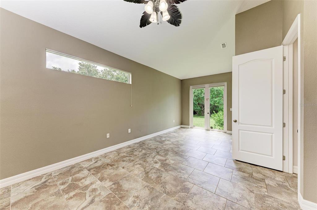 337 Snapdragon Loop Bradenton, FL 34212 - Photo 4 of 54 a view of an empty room with a window