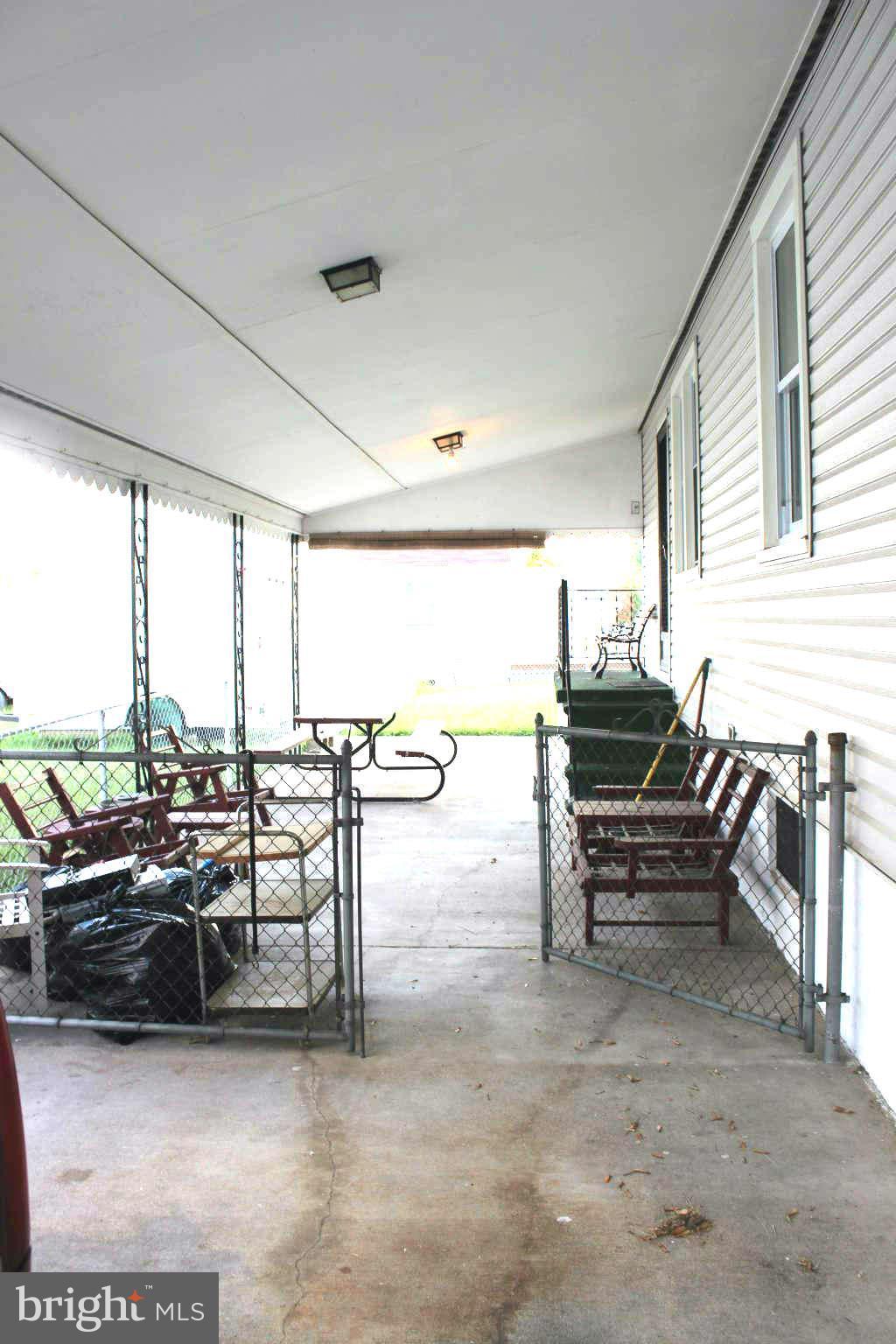 1319 North Point Road Dundalk, MD 21222 - Photo 21 of 24 a living room with furniture a flat screen tv and a large window