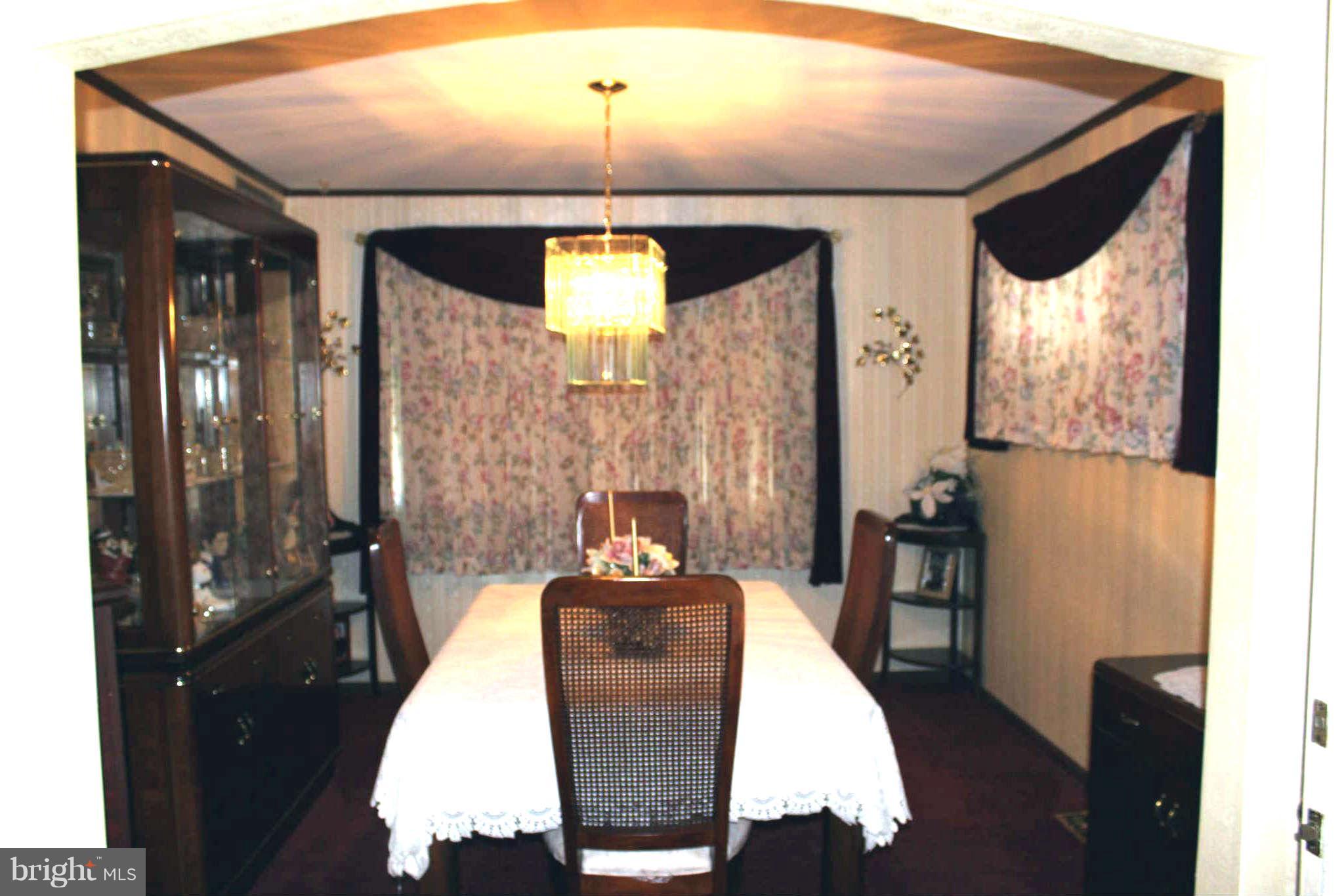 1319 North Point Road Dundalk, MD 21222 - Photo 5 of 24 a dining room with furniture and wooden floor