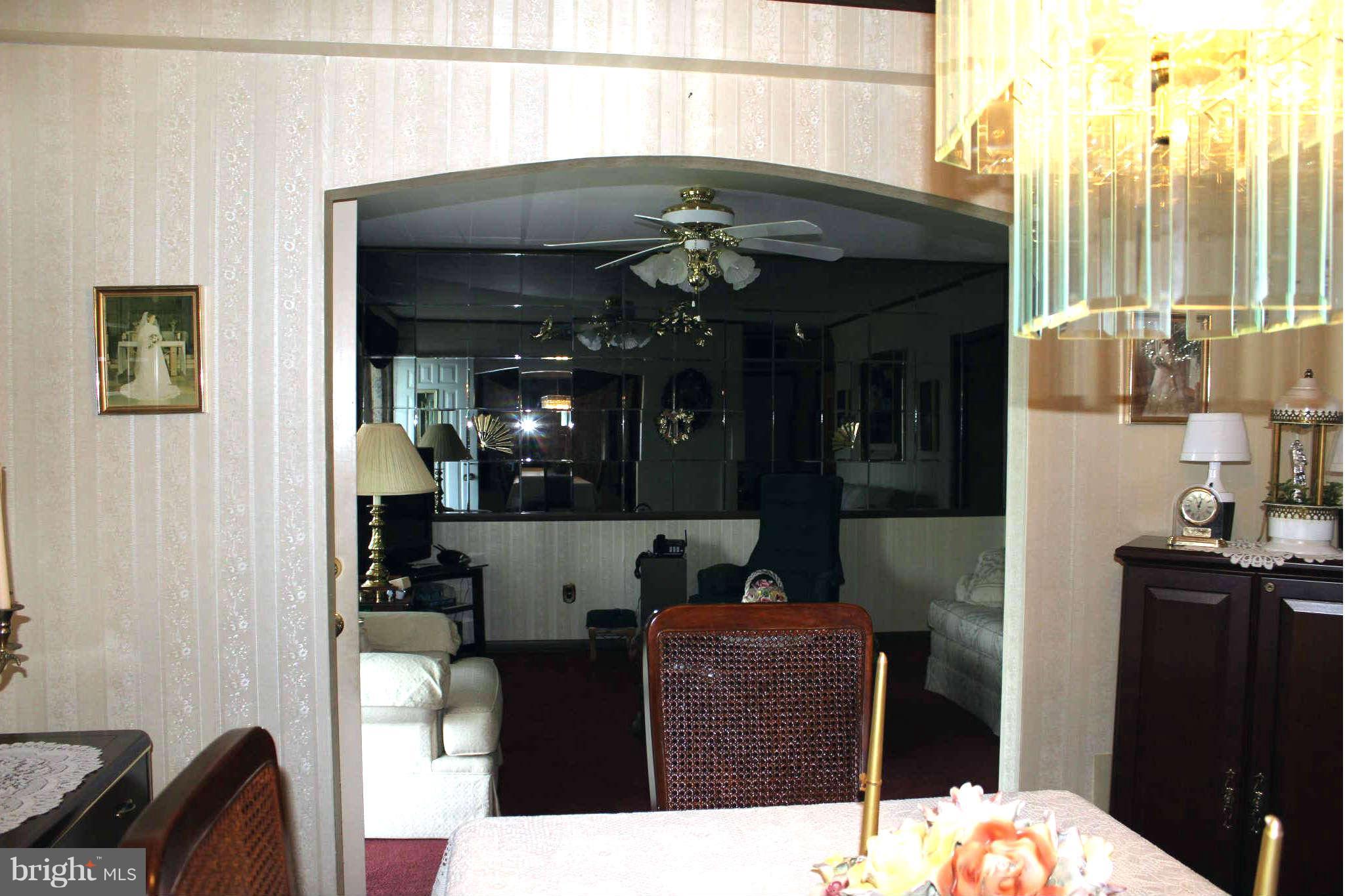 1319 North Point Road Dundalk, MD 21222 - Photo 6 of 24 a living room with furniture and a chandelier