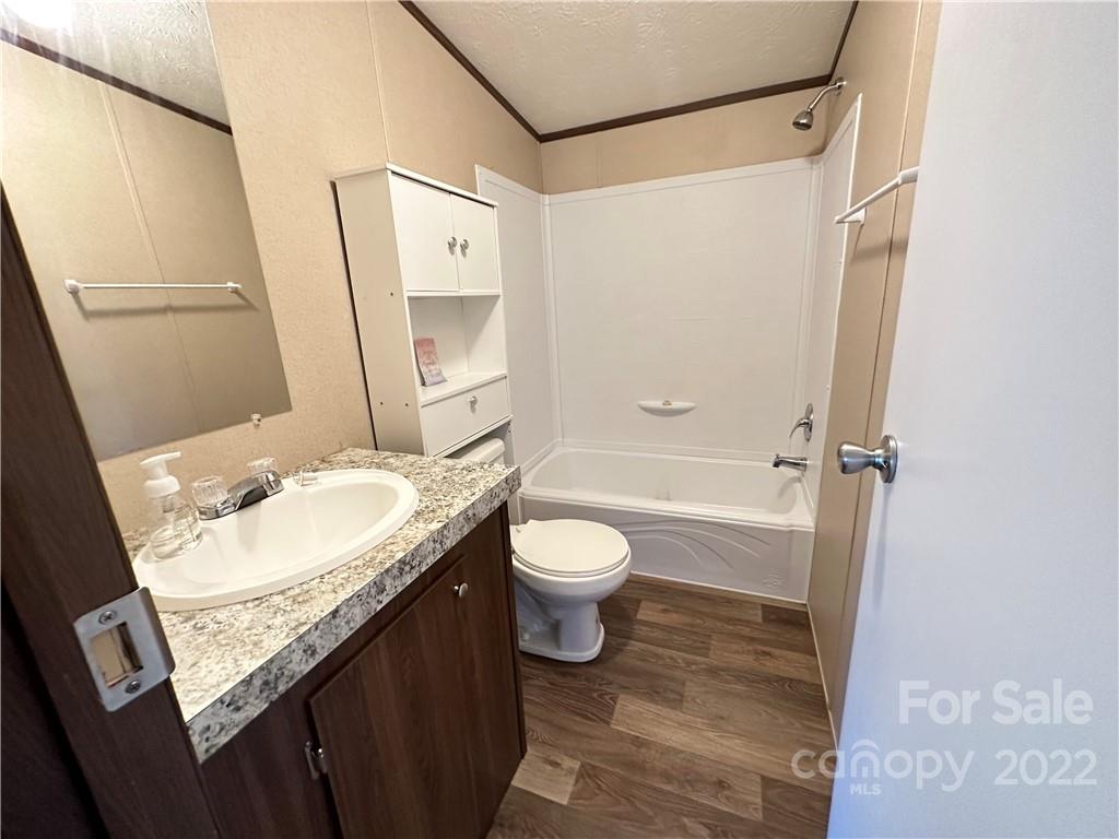 232 Jim Patterson Road Kings Mountain, NC 28086 - Photo 10 of 13 a bathroom with a granite countertop sink toilet and shower