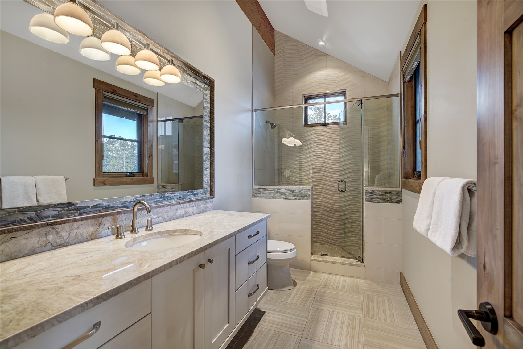 422 Timbertrail Road Breckenridge, CO 80424 - Photo 36 of 50 a bathroom with a granite countertop sink toilet and shower