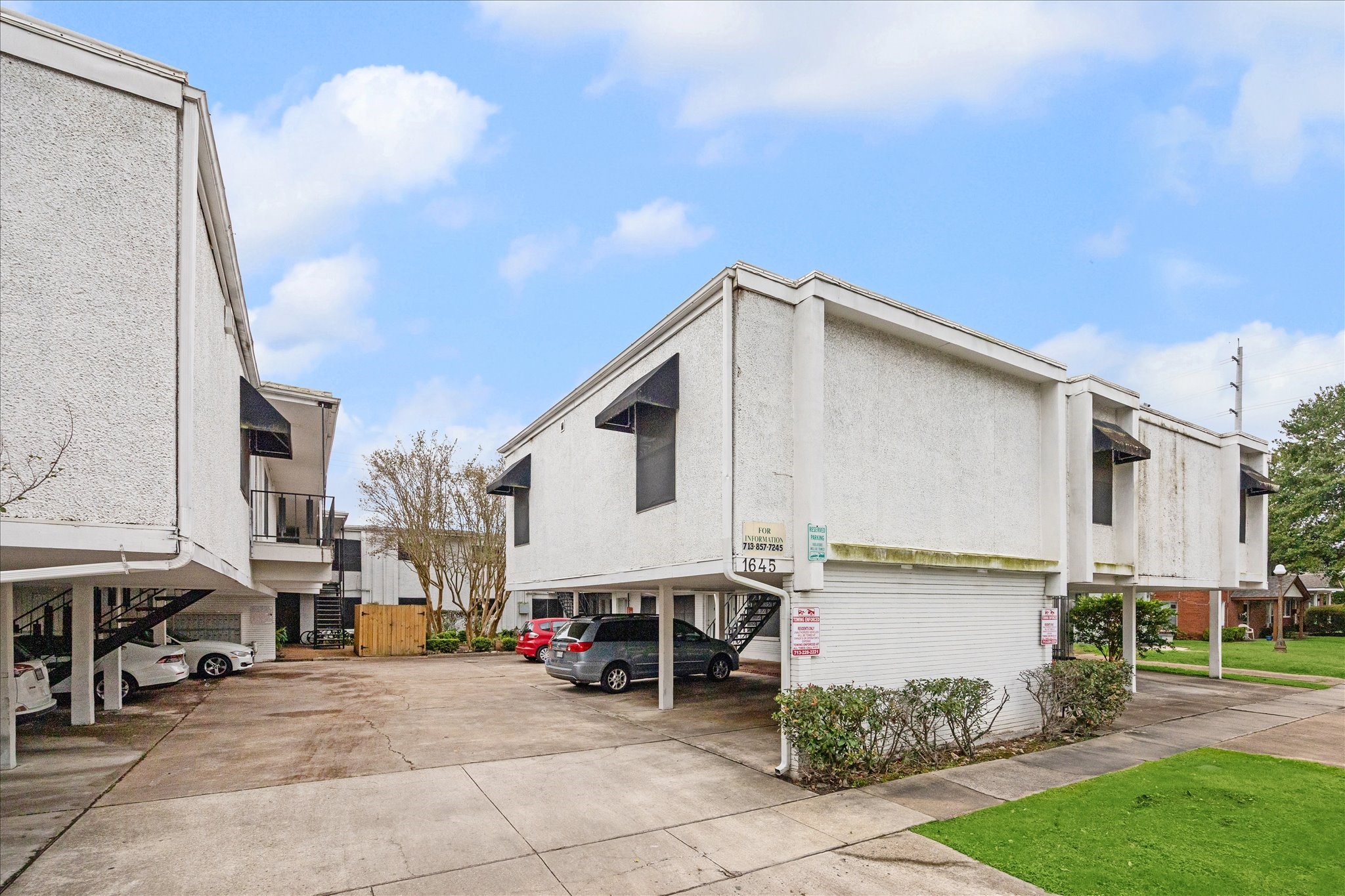 1645 West Main Street, Unit 9 Houston, TX 77006 - Photo 2 of 12 a view of a street with cars