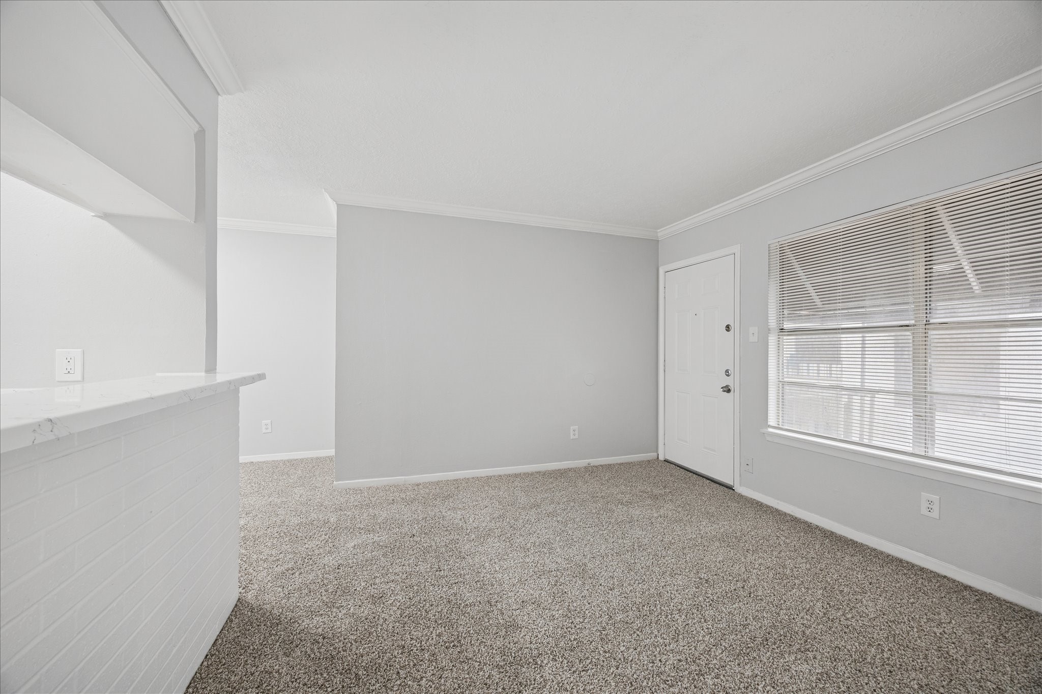 1645 West Main Street, Unit 9 Houston, TX 77006 - Photo 4 of 12 a view of an empty room with a window