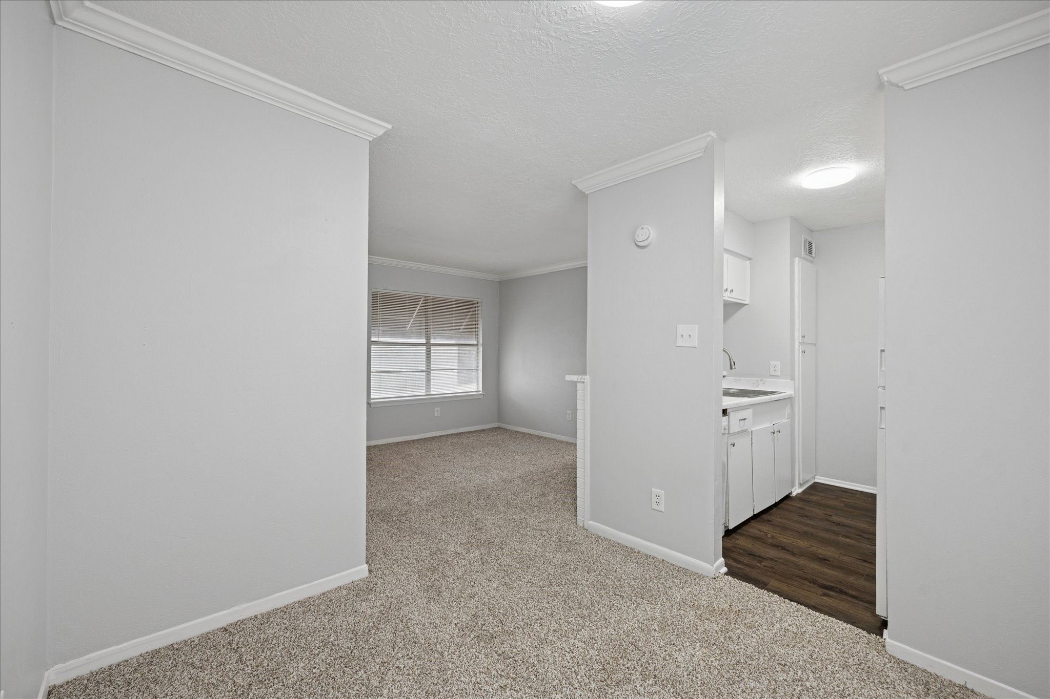 1645 West Main Street, Unit 9 Houston, TX 77006 - Photo 6 of 12 a view of an empty room with wooden floor and closet
