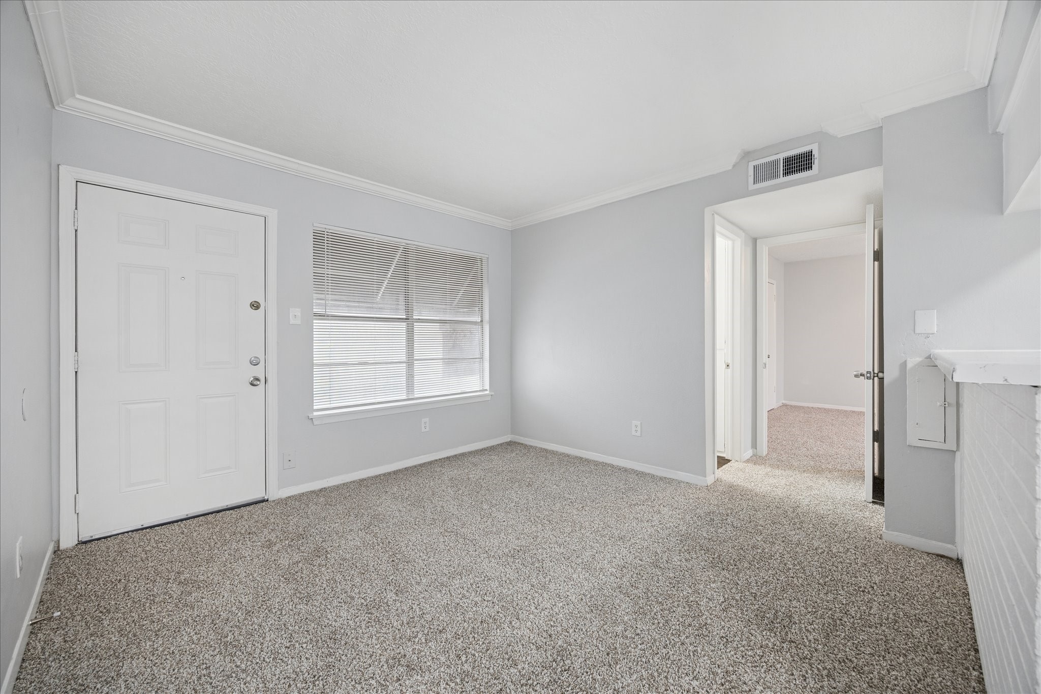 1645 West Main Street, Unit 9 Houston, TX 77006 - Photo 9 of 12 a view of an empty room with a window