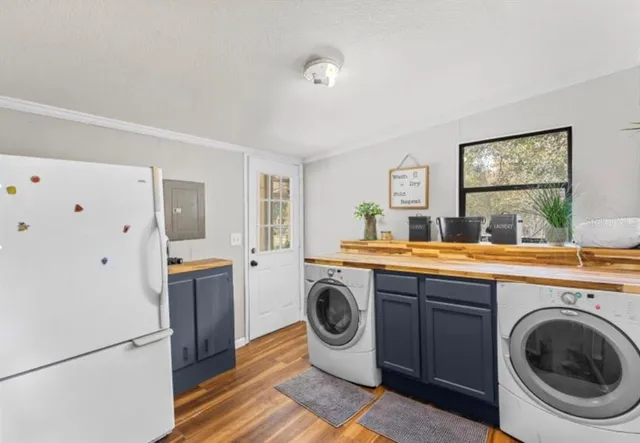 a view of a kitchen with washer and dryer