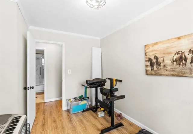 a view of a workspace with furniture and wooden floor