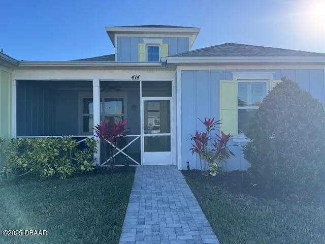 front view of a house with a yard