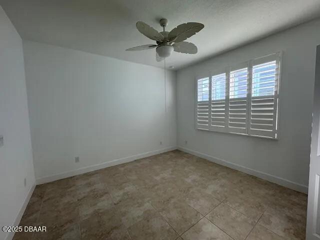 an empty room with a empty space and windows