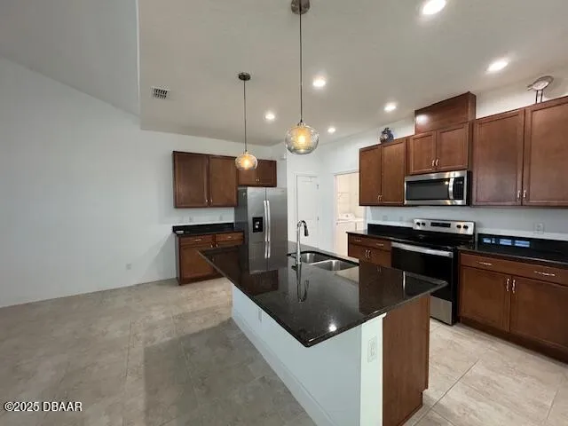 a kitchen with granite countertop a sink a counter top space appliances and cabinets