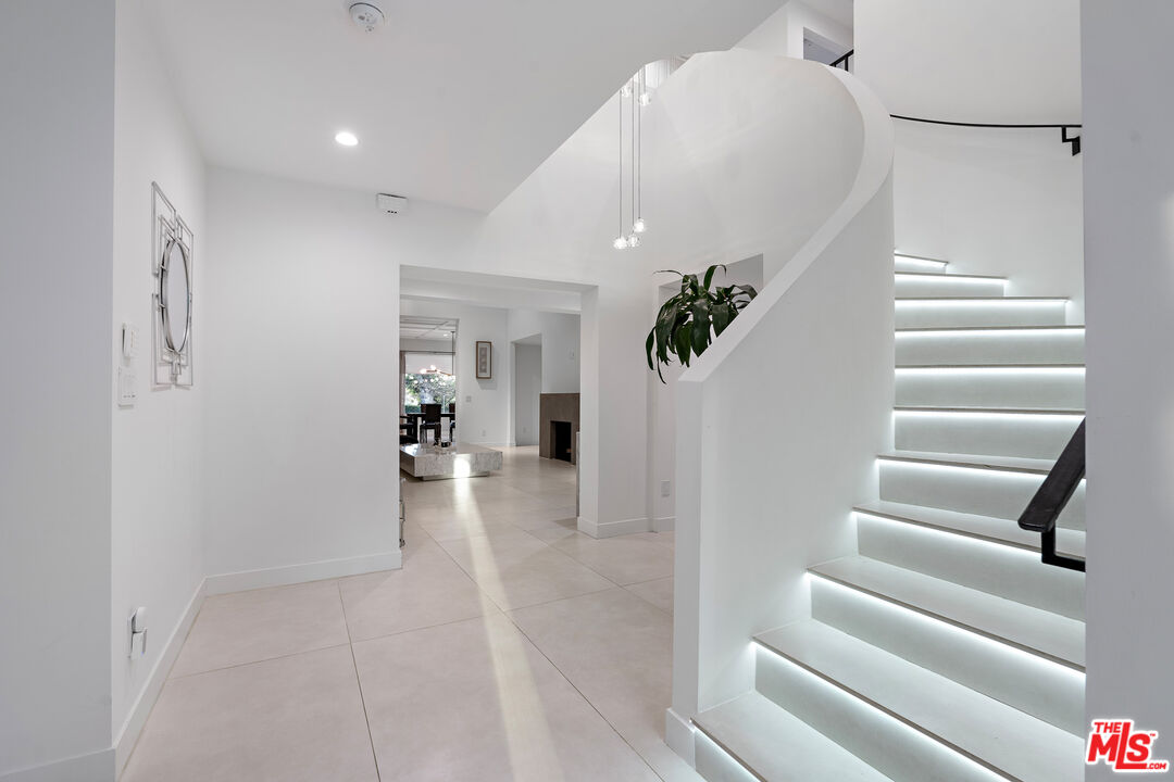 201 South Bedford Drive Beverly Hills, CA 90212 - Photo 13 of 37 a view of entryway and hall with wooden floor