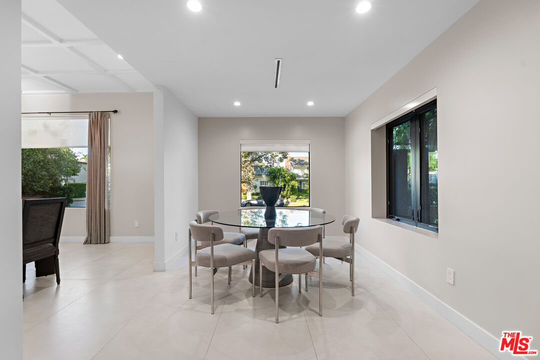 201 South Bedford Drive Beverly Hills, CA 90212 - Photo 18 of 37 a dining room with furniture and window