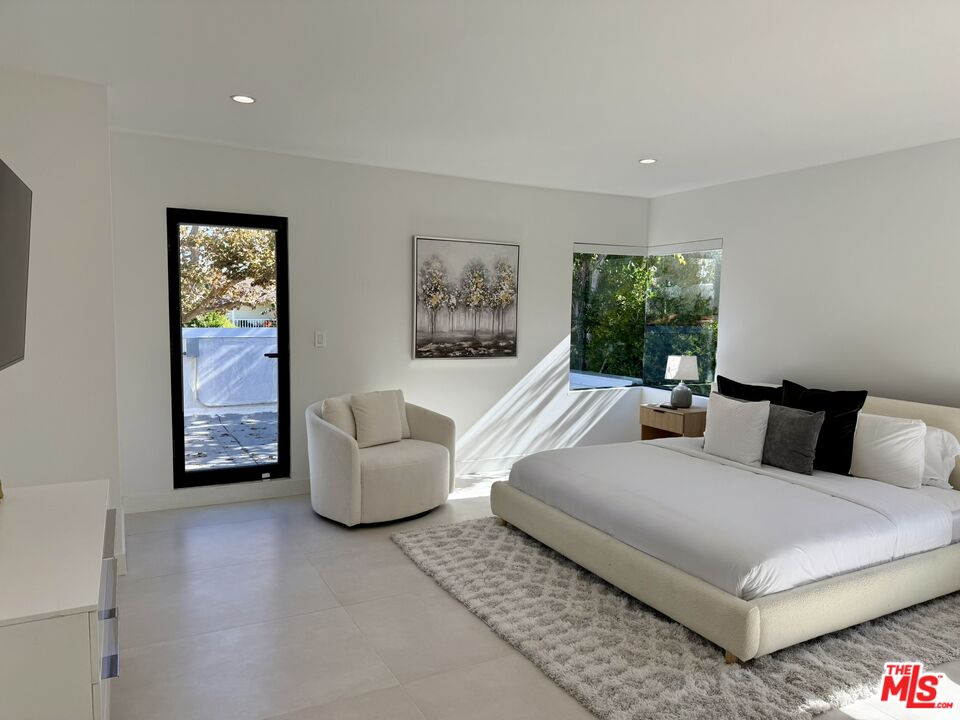 201 South Bedford Drive Beverly Hills, CA 90212 - Photo 20 of 37 a living room with furniture and a window