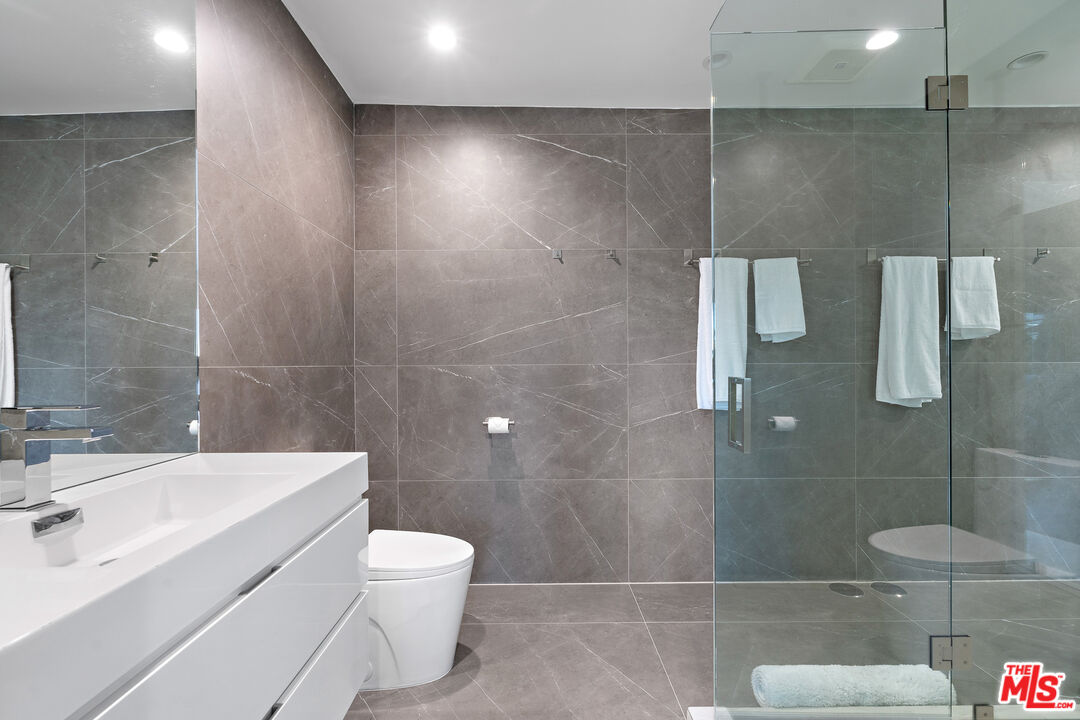 201 South Bedford Drive Beverly Hills, CA 90212 - Photo 32 of 37 a bathroom with a sink toilet and shower