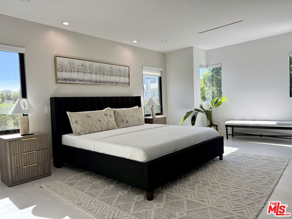 201 South Bedford Drive Beverly Hills, CA 90212 - Photo 4 of 37 a bedroom with a bed and window