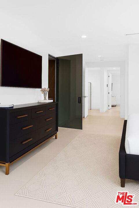 201 South Bedford Drive Beverly Hills, CA 90212 - Photo 6 of 37 a living room with furniture and a flat screen tv