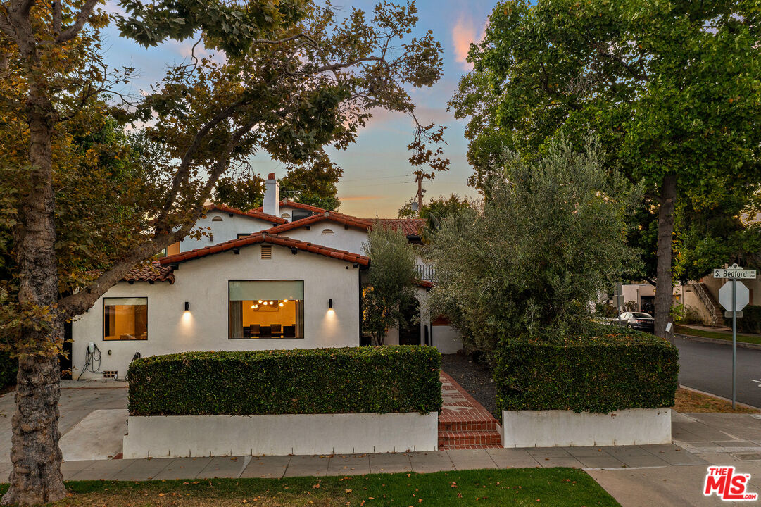 201 South Bedford Drive Beverly Hills, CA 90212 - Photo 8 of 37 a front view of a house with a yard