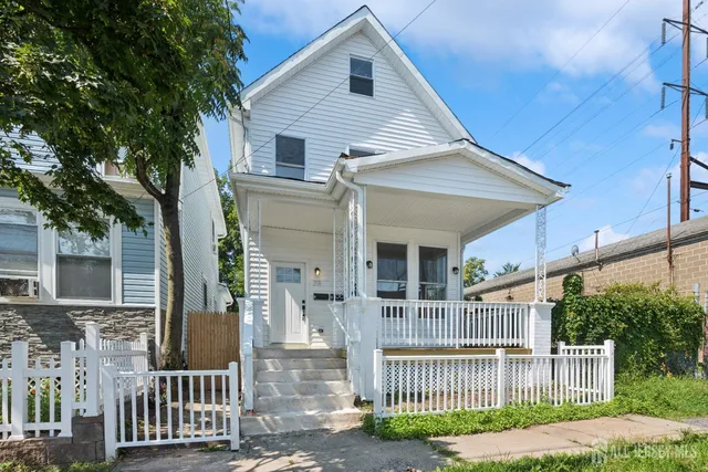 front view of a house with a small yard