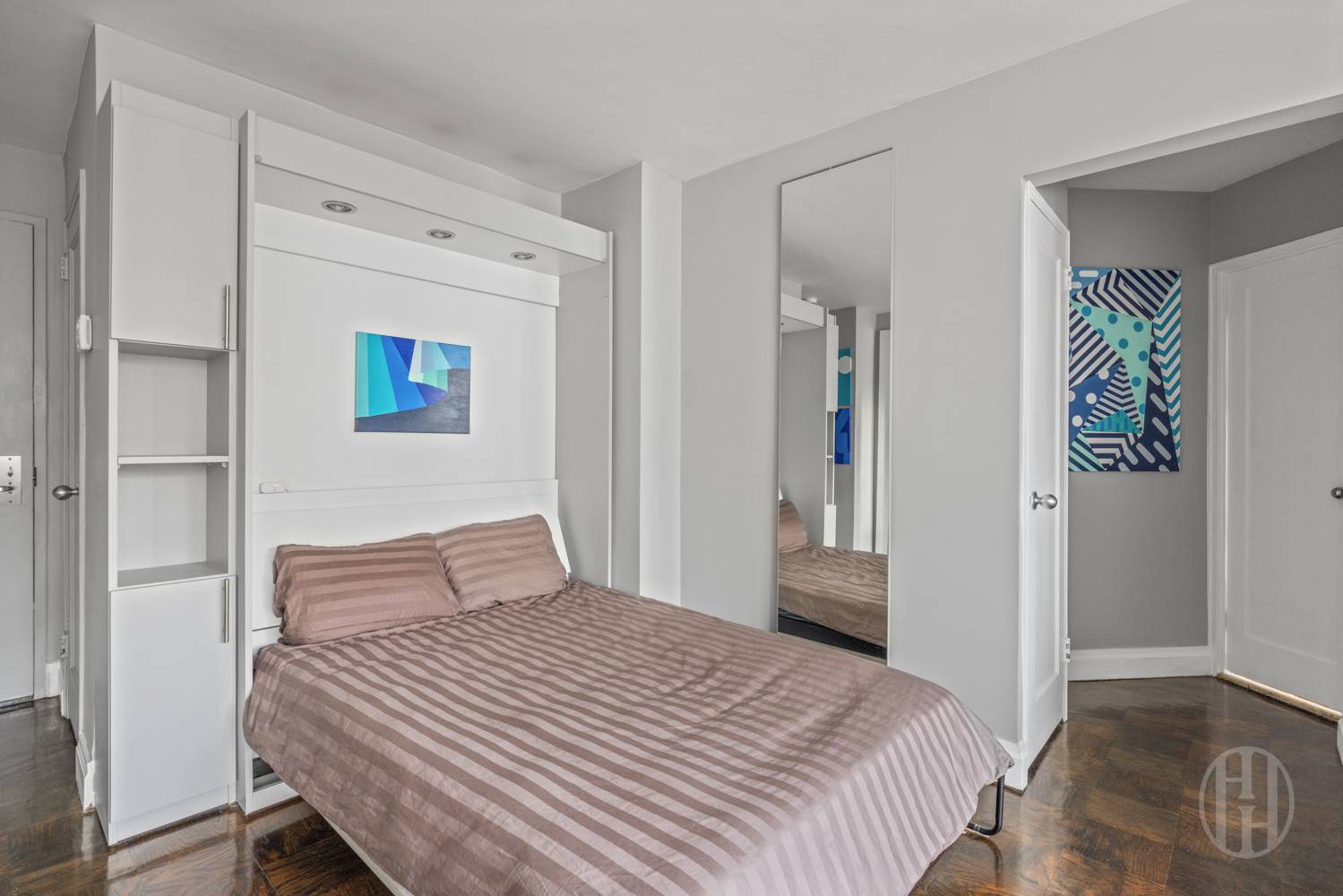 225 East 36th Street, Unit 14M Manhattan, NY 10016 - Photo 3 of 8 a bedroom with a bed and a window