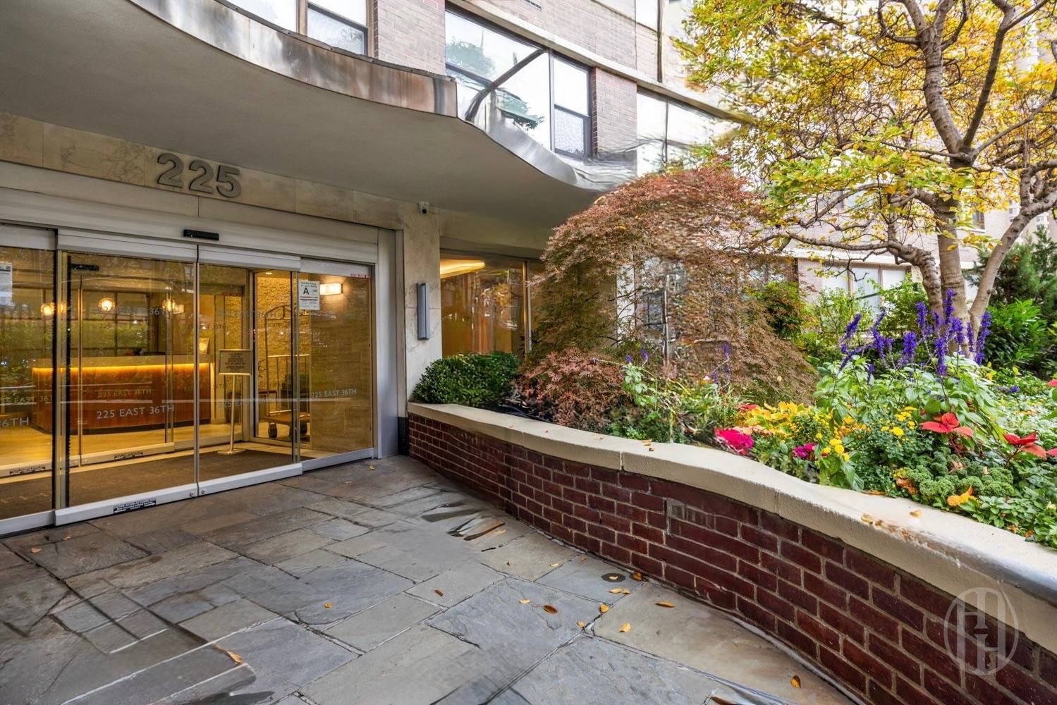 225 East 36th Street, Unit 14M Manhattan, NY 10016 - Photo 7 of 8 a view of path along with wooden floor and seating space