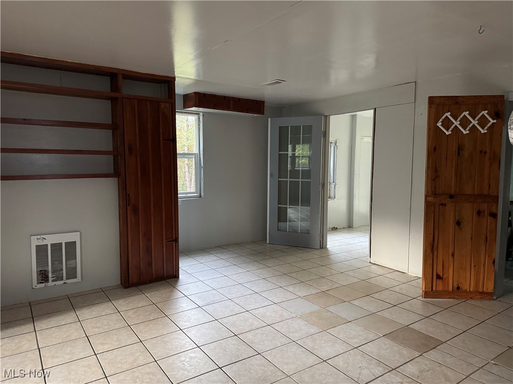 2360 Scio Road Carrollton, OH 44615 - Photo 15 of 22 Unfurnished room with heating unit and light tile patterned floors