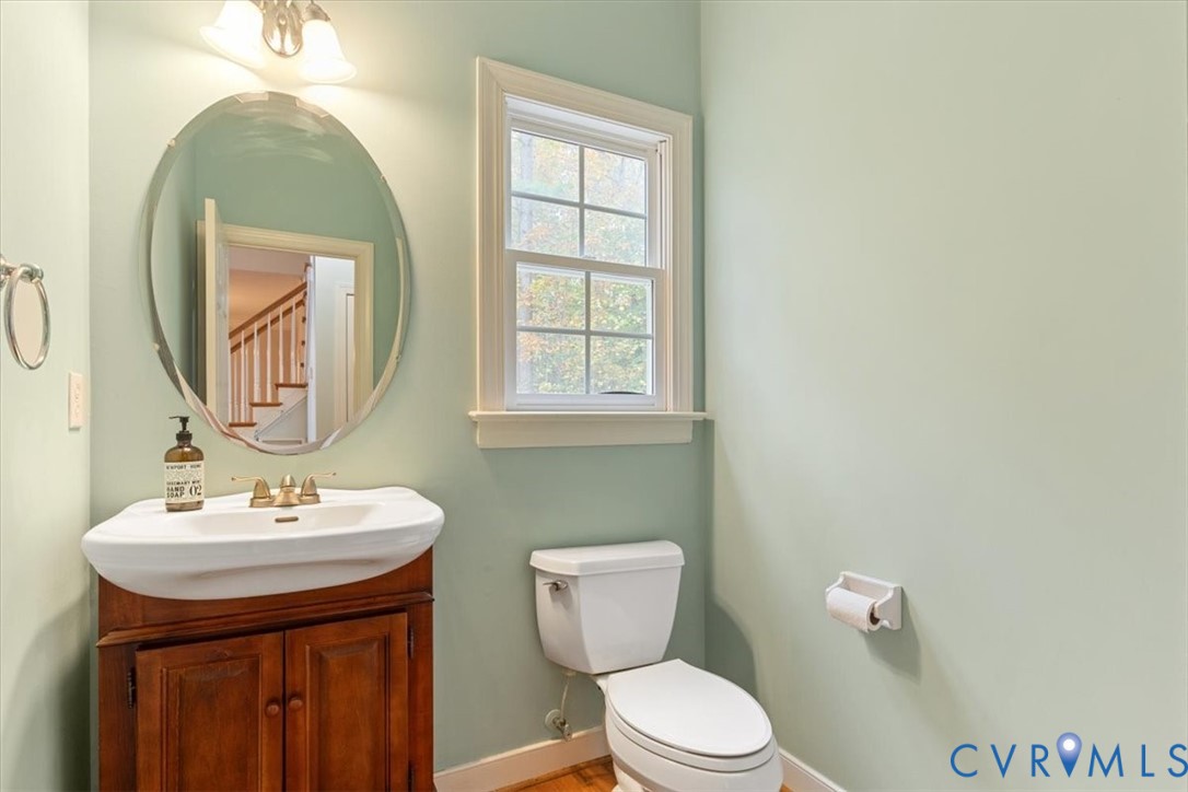 17595 Circuit Rider Drive Beaverdam, VA 23015 - Photo 15 of 29 a bathroom with a toilet a sink and mirror