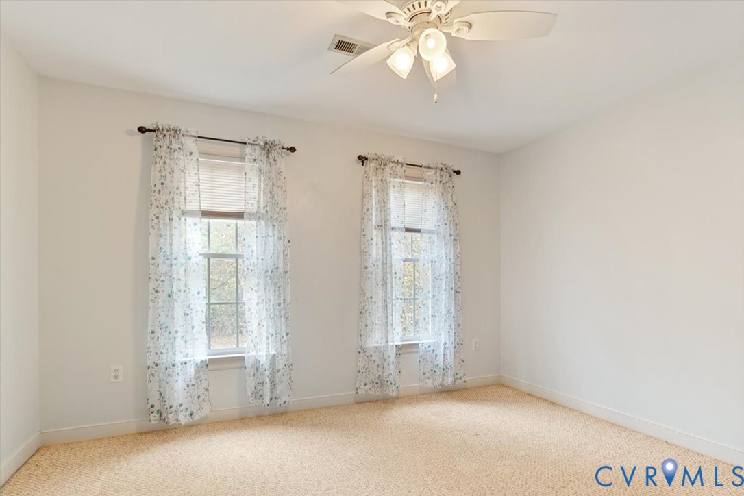 17595 Circuit Rider Drive Beaverdam, VA 23015 - Photo 16 of 29 an empty room with windows and fan