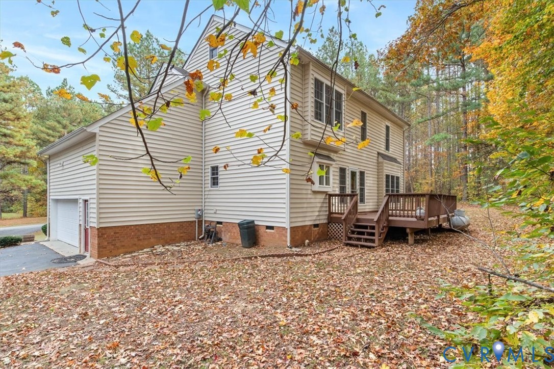17595 Circuit Rider Drive Beaverdam, VA 23015 - Photo 23 of 29 a backyard of a house with table and chairs