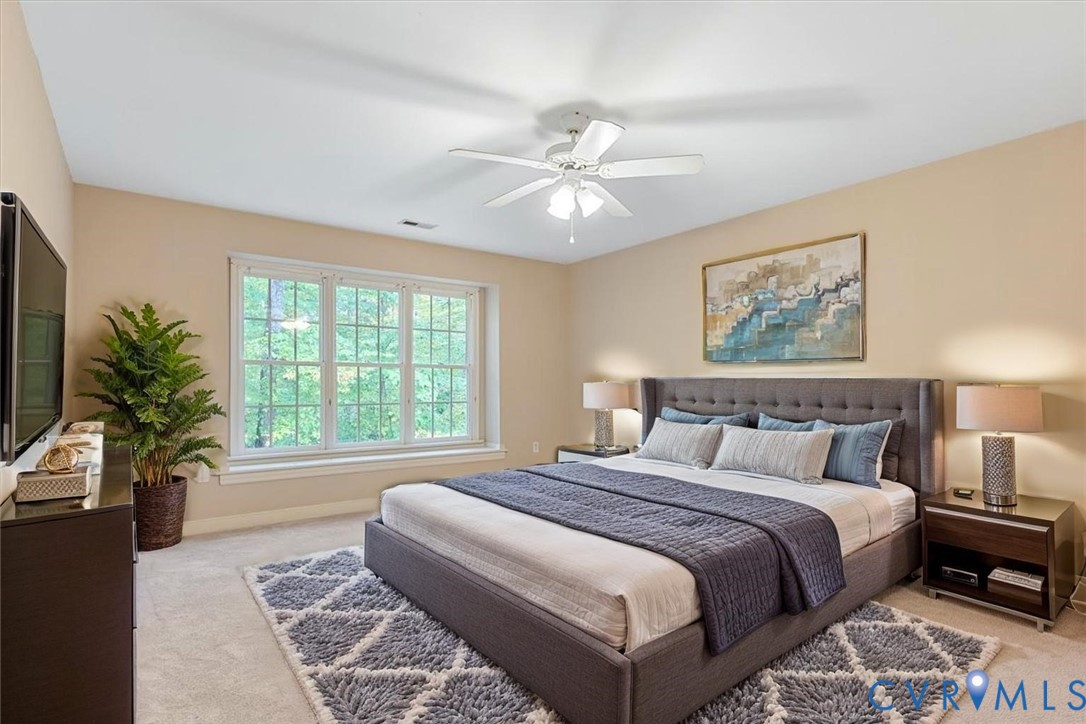 17595 Circuit Rider Drive Beaverdam, VA 23015 - Photo 4 of 29 a bedroom with a large bed and a chandelier fan