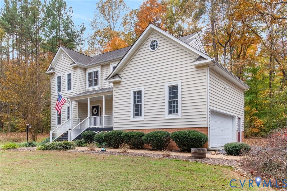 17595 Circuit Rider Drive Beaverdam, VA 23015 - Photo 6 of 29 a front view of a house with a yard and potted plants