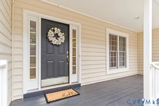 a view of front door with wooden floor
