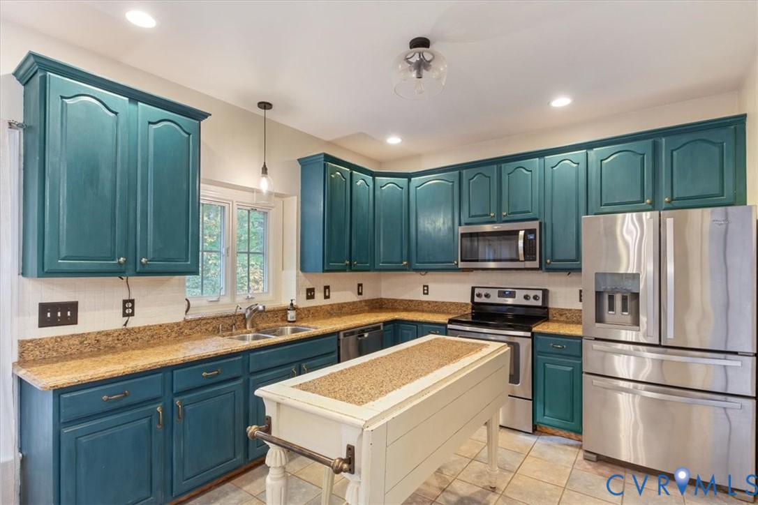 17595 Circuit Rider Drive Beaverdam, VA 23015 - Photo 10 of 29 a kitchen with kitchen island a sink stainless steel appliances and cabinets