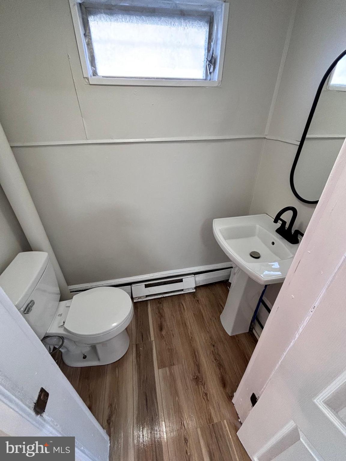 343 Chestnut Street Reading, PA 19602 - Photo 12 of 16 a bathroom with a toilet sink and mirror