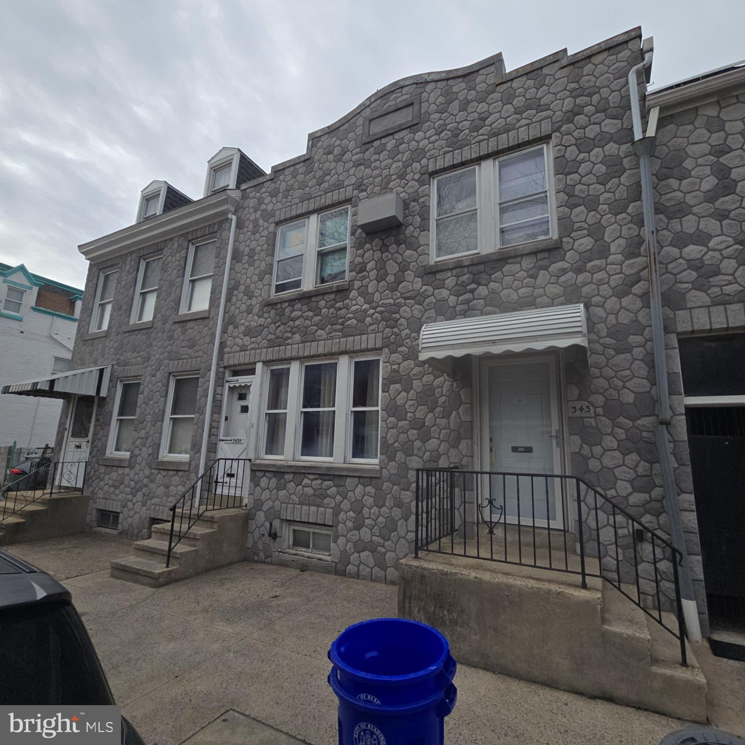 343 Chestnut Street Reading, PA 19602 - Photo 16 of 16 a brick building with a bench in front of it