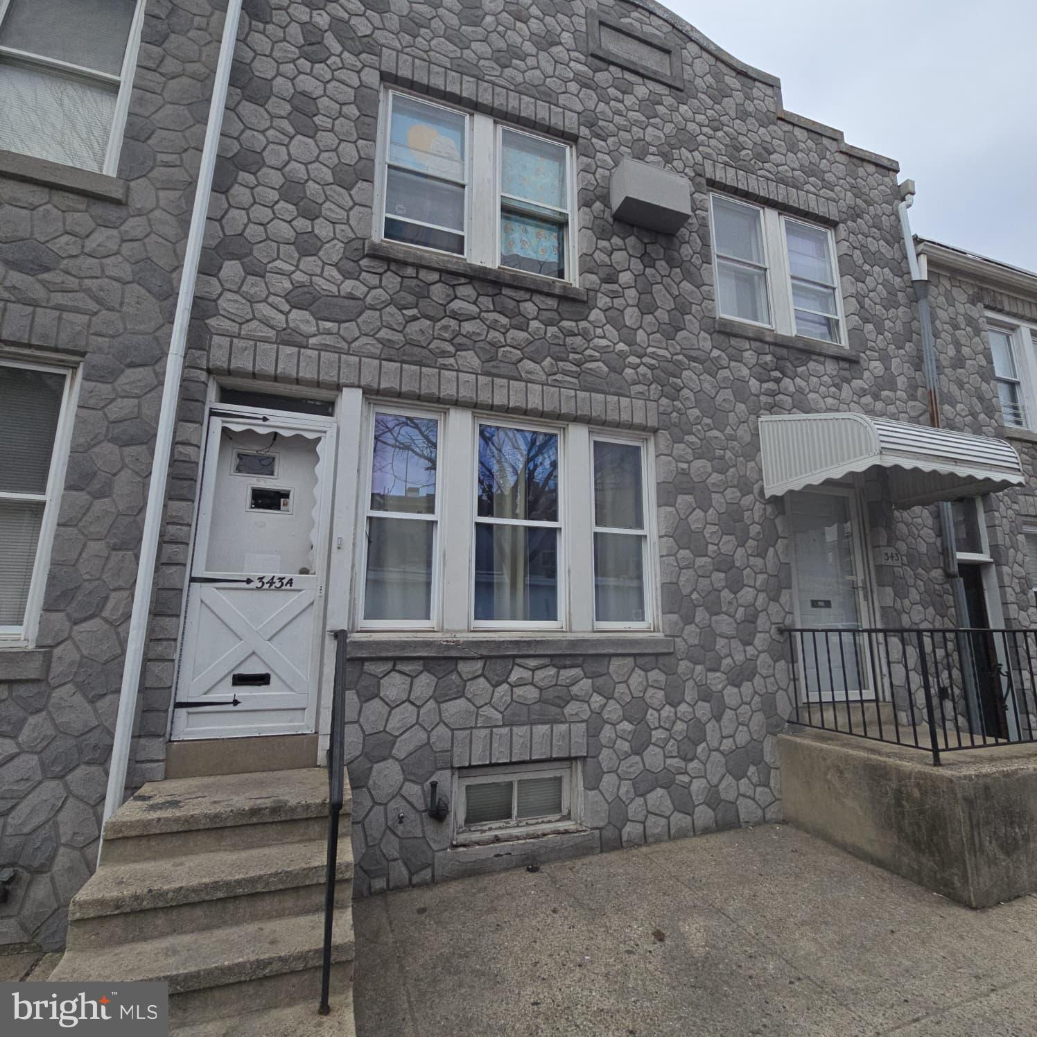343 Chestnut Street Reading, PA 19602 - Photo 2 of 16 a front view of a house with a window