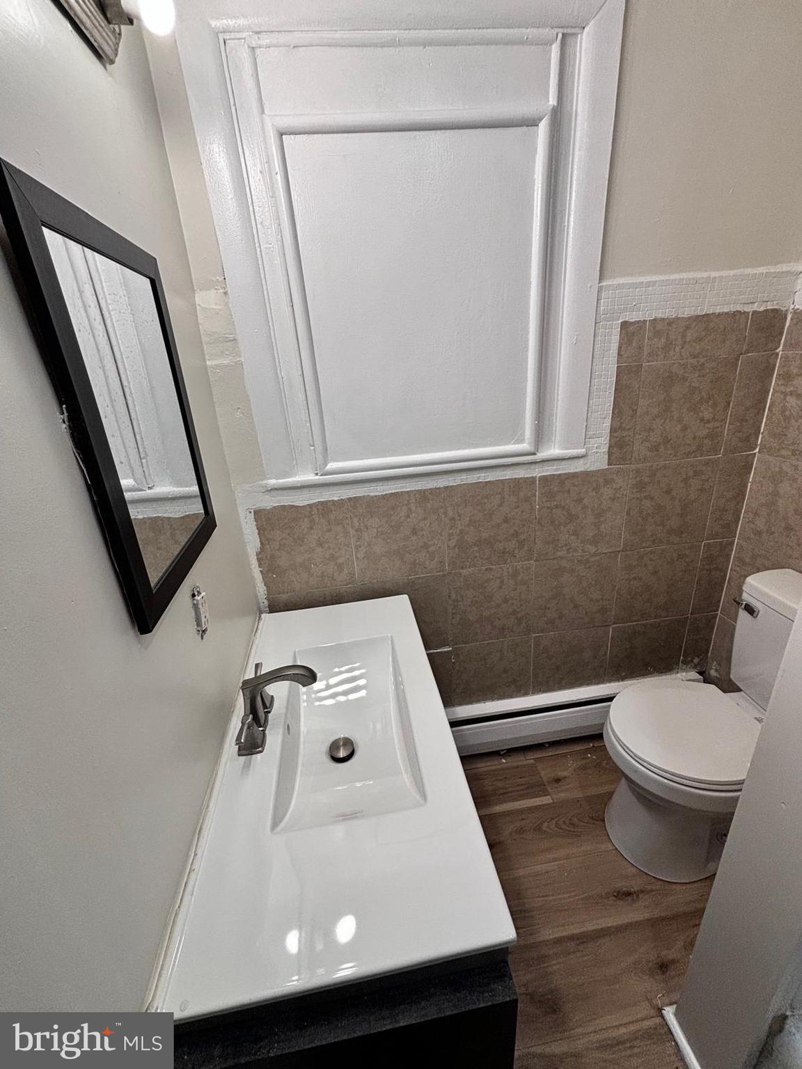343 Chestnut Street Reading, PA 19602 - Photo 9 of 16 a bathroom with a sink and a toilet