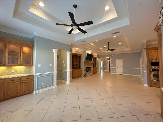 a view of a lobby with furniture and a ceiling fan