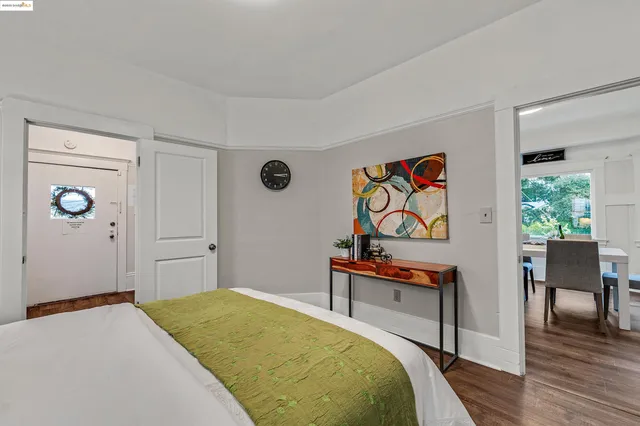 a bedroom with a bed and a bookshelf in it